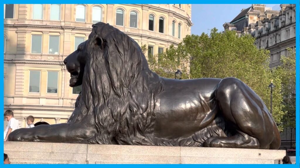 One of the bronze lion statues in Trafalgar Square London measuring 20 feet long